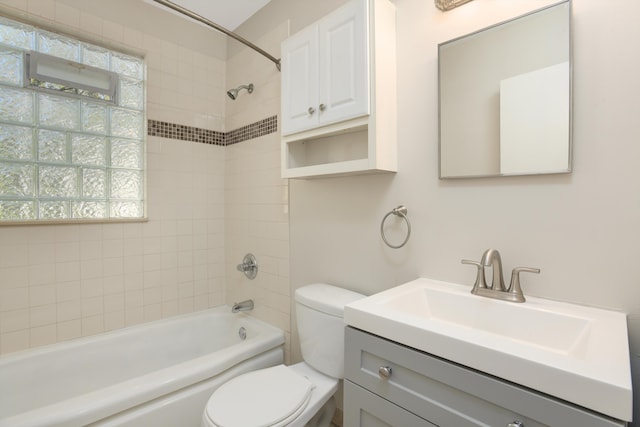 full bathroom featuring vanity, toilet, and tiled shower / bath