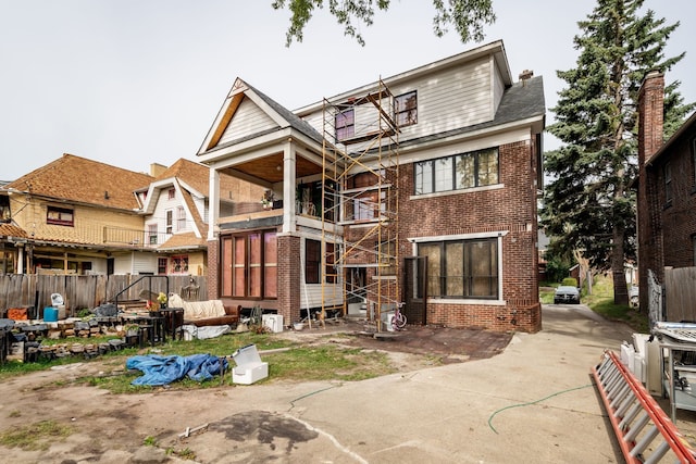 rear view of house featuring a balcony