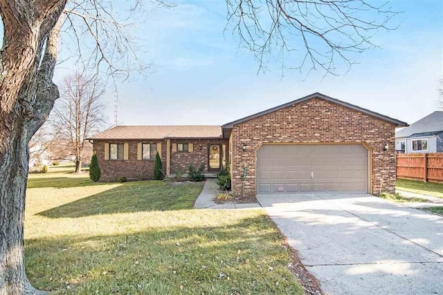 ranch-style home with a garage and a front lawn