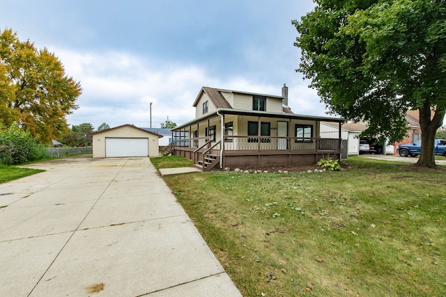 farmhouse featuring a front lawn, covered porch, an outdoor structure, and a garage