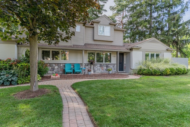 view of front of home with a front lawn