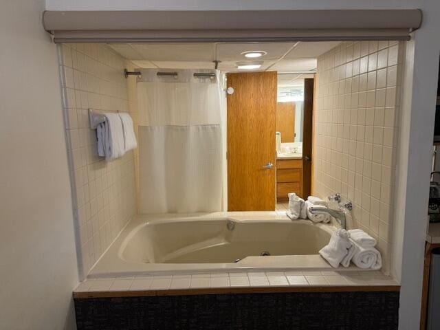 bathroom featuring tiled bath