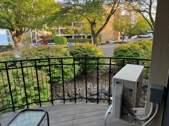 balcony featuring ac unit