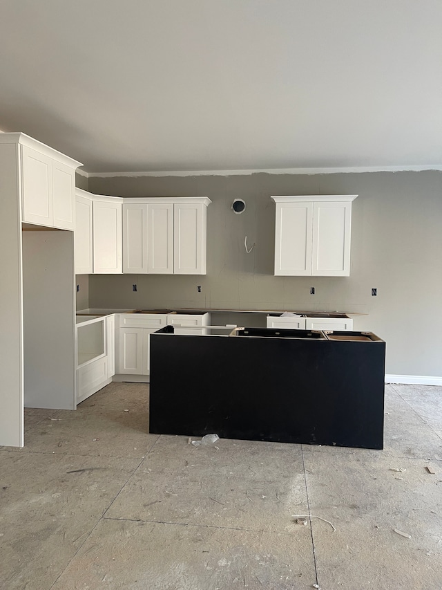 kitchen featuring white cabinets and a center island