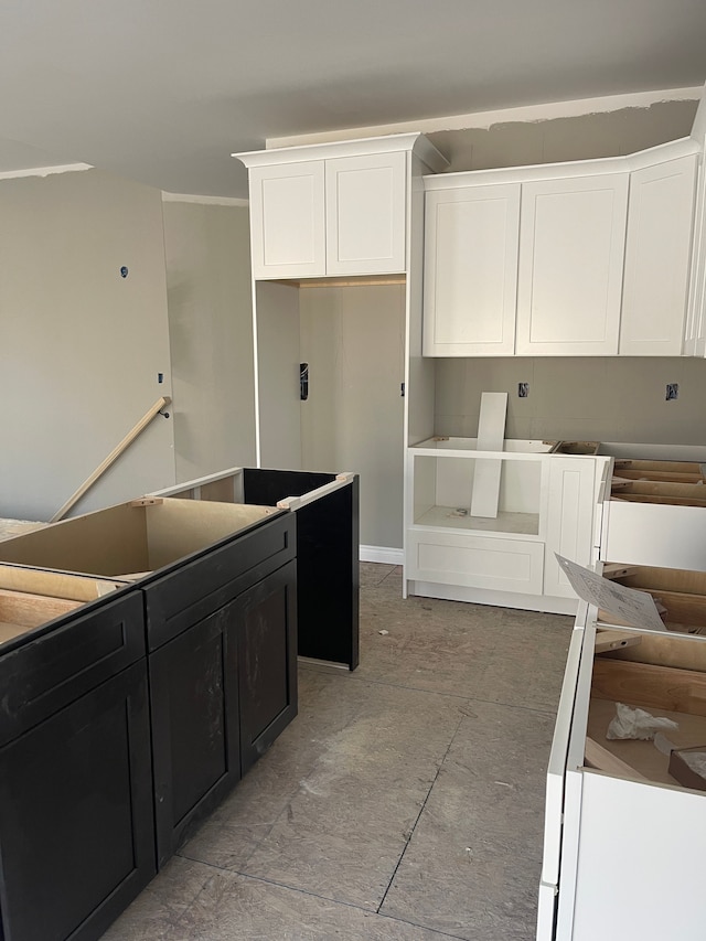 kitchen with white cabinetry and dark cabinetry