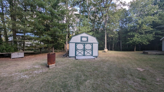 view of outdoor structure featuring a lawn