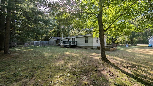 view of yard with a wooden deck