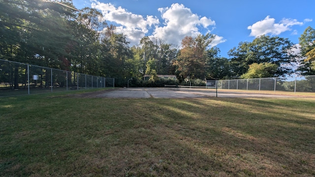 view of yard featuring tennis court