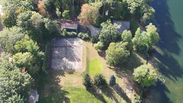 birds eye view of property with a water view