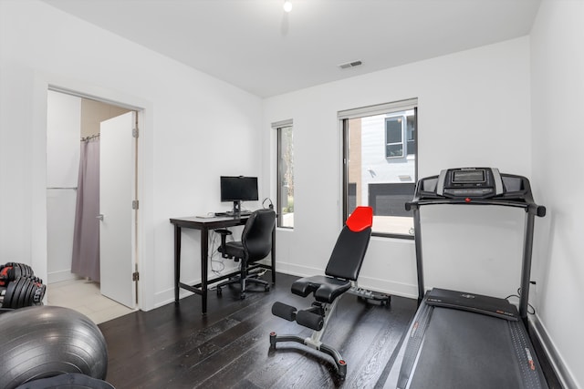 exercise area with wood-type flooring