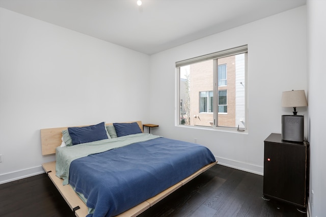 bedroom featuring dark hardwood / wood-style floors