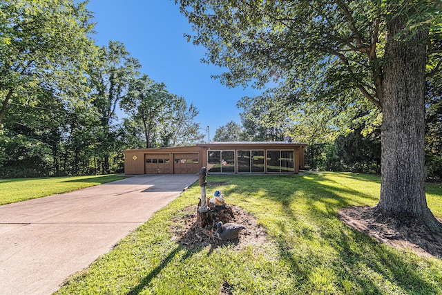 view of front of home featuring a sunroom and a front lawn