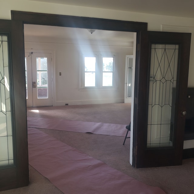 foyer featuring carpet