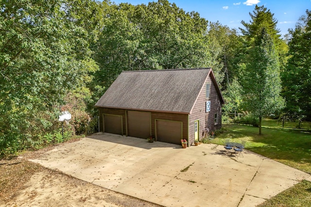 garage with a lawn