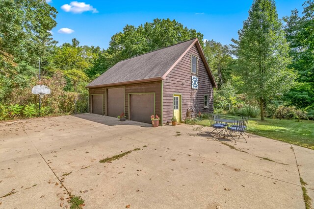 2488 Wilson St, Hillsdale, MI 49242 - detached garage with view of wooded area