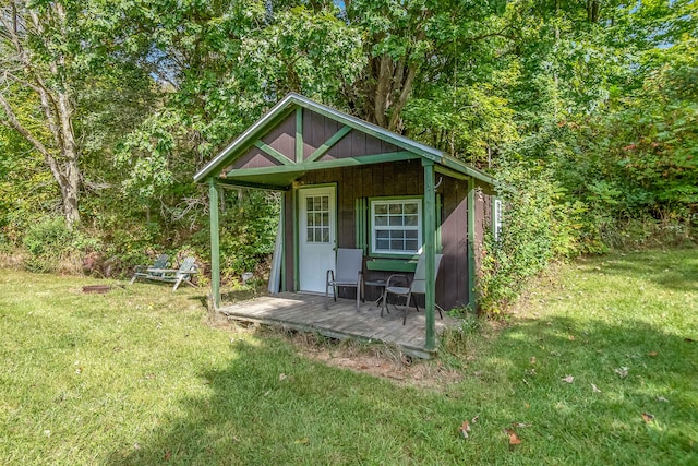 view of outbuilding featuring a yard