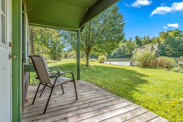2488 Wilson St, Hillsdale, MI 49242 - deck featuring a water view, a lawn, and view of scattered trees