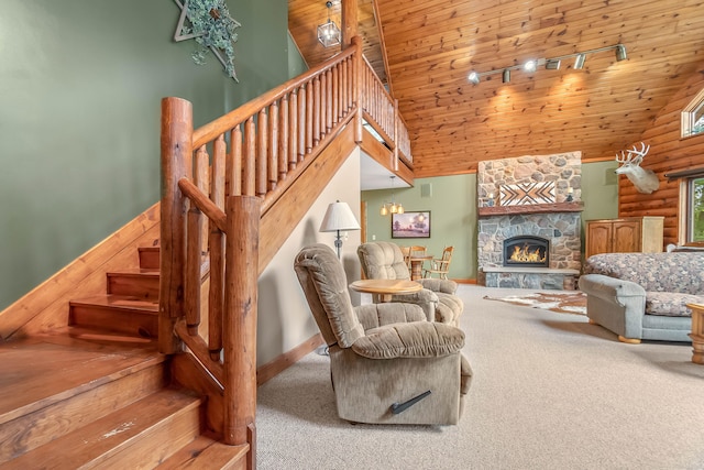 living room featuring a stone fireplace, wooden ceiling, carpet floors, and high vaulted ceiling