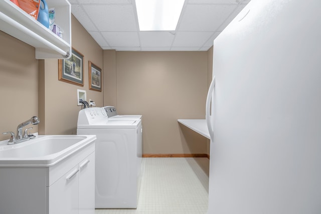 laundry area featuring sink and independent washer and dryer
