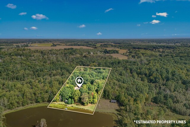 2488 Wilson St, Hillsdale, MI 49242 - aerial view of property and surrounding area with a heavily wooded area, a large body of water, and property boundaries highlighted