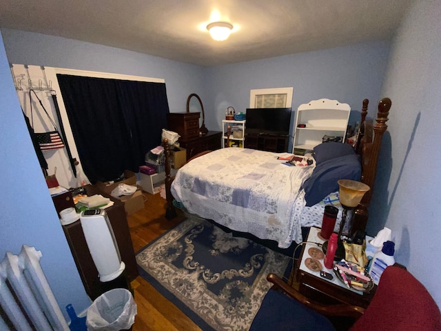 bedroom featuring hardwood / wood-style flooring