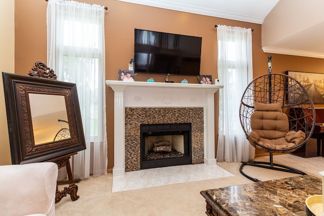 living area featuring light colored carpet and crown molding