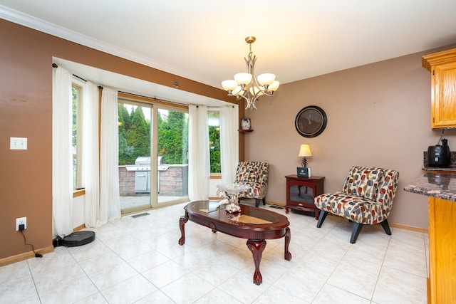 sitting room with a notable chandelier, ornamental molding, and light tile patterned floors