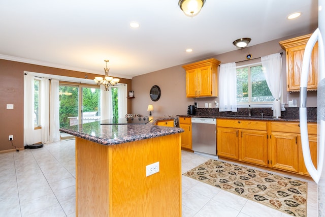 kitchen featuring stainless steel dishwasher, ornamental molding, dark stone counters, black electric cooktop, and a chandelier