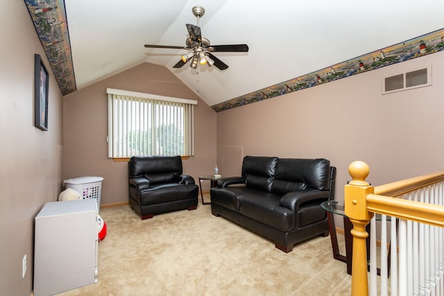 living room featuring ceiling fan, light colored carpet, and lofted ceiling