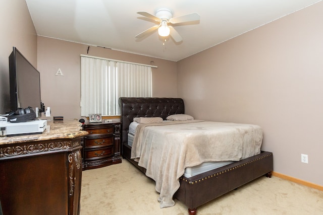 bedroom featuring ceiling fan and light carpet