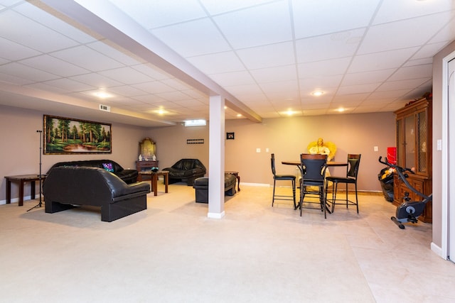 living room featuring a drop ceiling