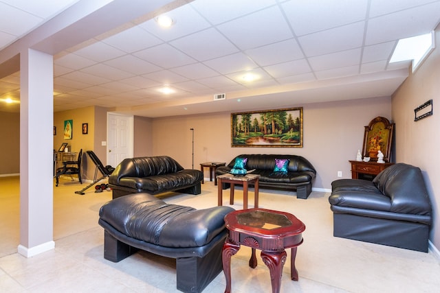 living room with a drop ceiling