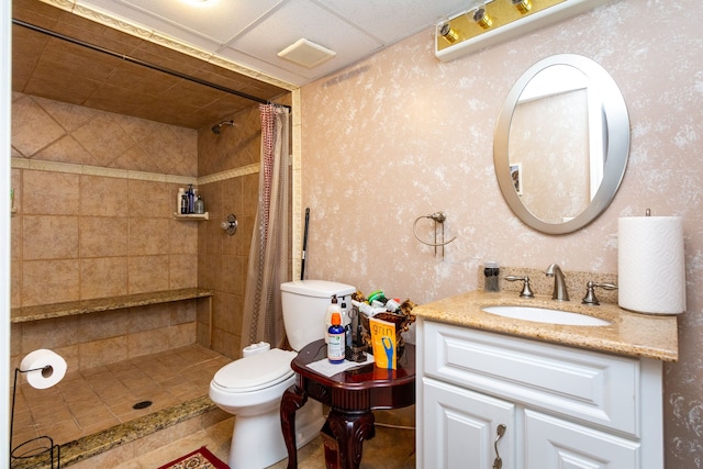 bathroom with tile patterned floors, vanity, toilet, and walk in shower