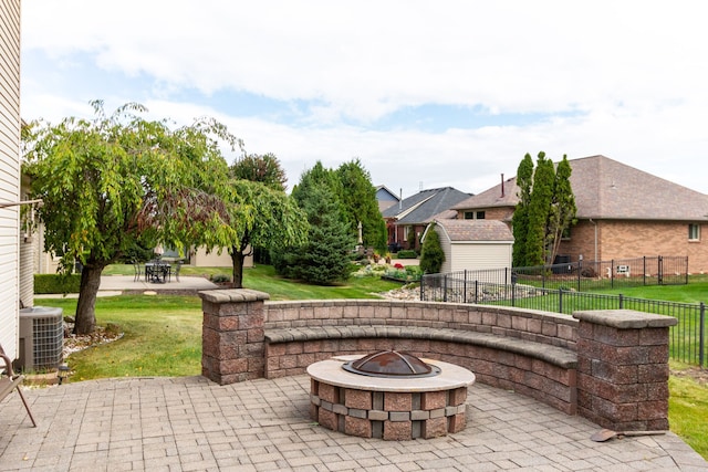 view of patio / terrace featuring a fire pit and cooling unit