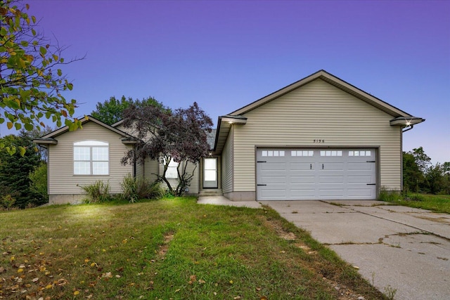 exterior space with a front yard and a garage