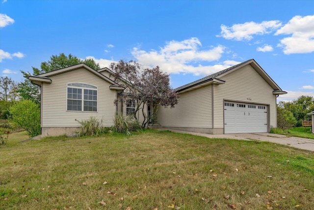 view of front of property with a front lawn and a garage