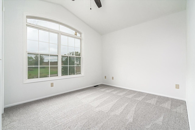 spare room with carpet flooring, ceiling fan, and lofted ceiling