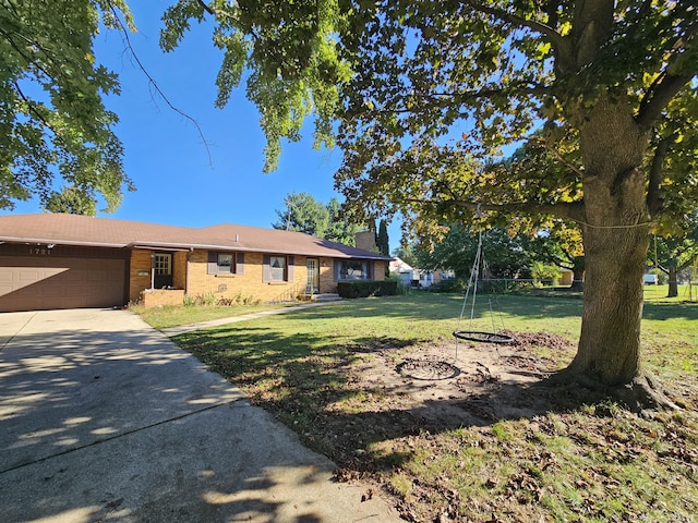 ranch-style home with a garage and a front yard