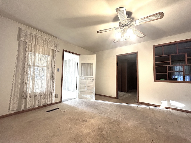 unfurnished bedroom with ceiling fan and carpet floors