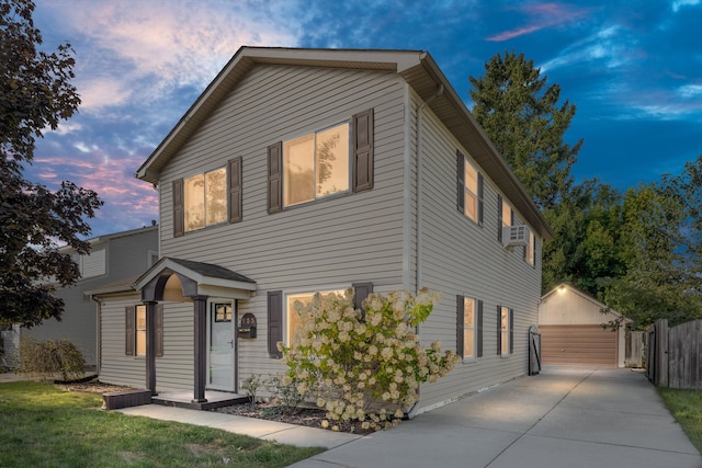 view of front property featuring a garage and an outdoor structure