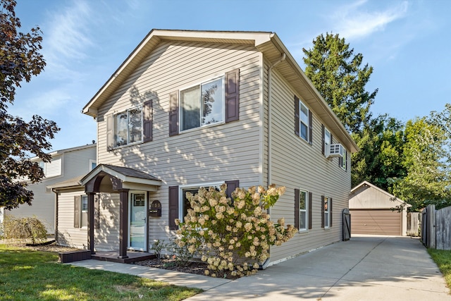 view of front of house featuring a garage and an outdoor structure