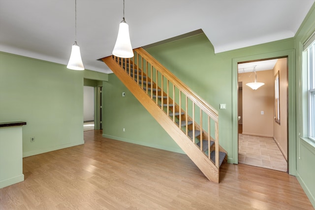 stairs with wood-type flooring