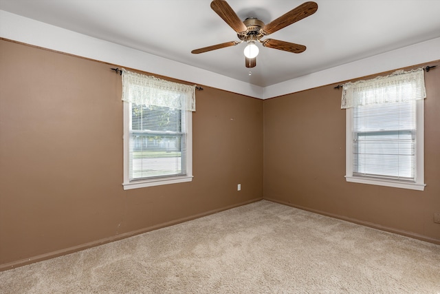 carpeted empty room with ceiling fan