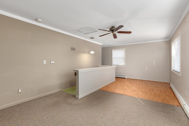 carpeted spare room featuring ceiling fan, crown molding, and a baseboard radiator