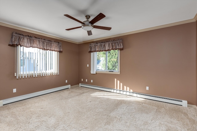 carpeted spare room with a baseboard heating unit, ceiling fan, and ornamental molding