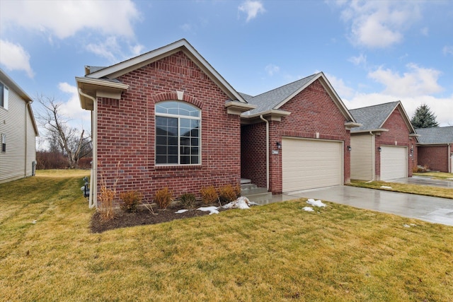 view of front of property with a garage, brick siding, driveway, and a front lawn