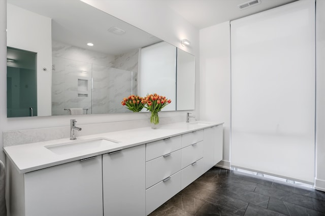 bathroom with vanity and walk in shower