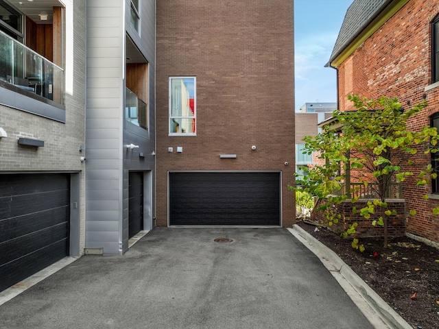 view of property exterior with a garage