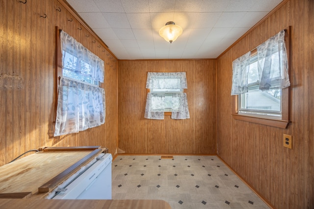 empty room featuring wooden walls