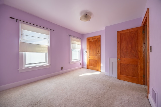 unfurnished bedroom with light carpet